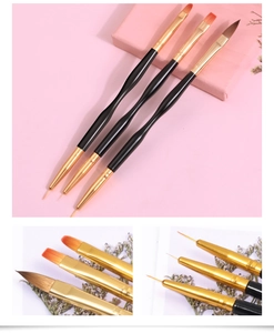 Dual-ended nail art brush set with black handles and fine golden metal tips for manicure