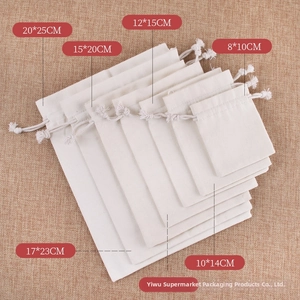 Detail view showing various sizes of cotton linen drawstring jewelry pouches from 8x10 to 20x25cm