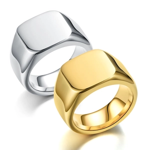 Close-up of square signet rings in polished gold and silver stainless steel finish