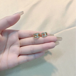 Elegant gold-plated H-shaped hoop earrings with sparkling paved zircons for a luxury look