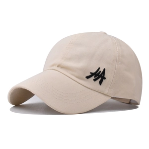 Detail of beige cotton ponytail baseball cap with black side embroidery and curved brim