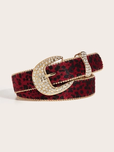 Detail of red leopard pony hair belt featuring gold rhinestone buckle and bead trim