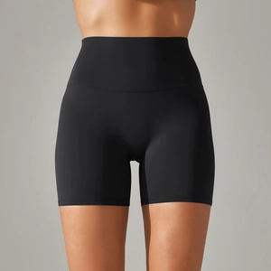 Detail of high-waist black yoga shorts showing double-sided brushed fabric and seamless stitching