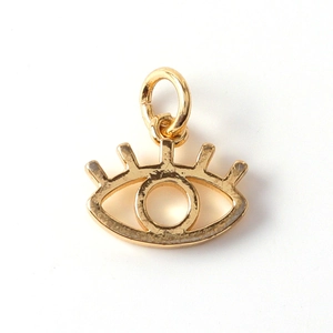 Detail view of a gold-plated eye charm with cubic zirconia for DIY jewelry making