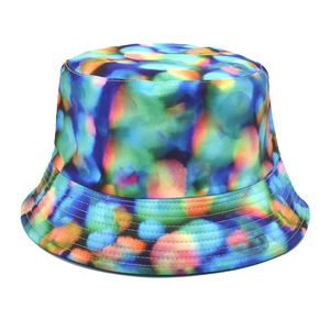 Detailed view of tie-dye bucket hat with colorful abstract patterns and stitched brim