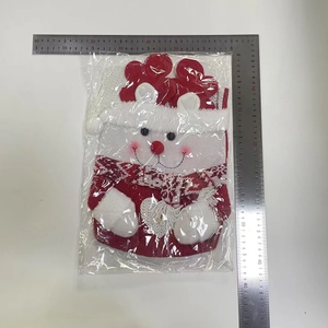 Detailed view of snowman Christmas gift bag measurements with rulers for size reference