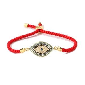 Detail of red evil eye bracelet showing micro-pave blue zircon and gold plating