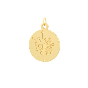 Detail of round golden pendant with engraved dandelion pattern and polished finish