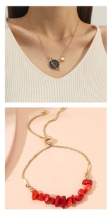 Detailed view of elegant gold tube pearl stretch bracelet and matching star planet necklace