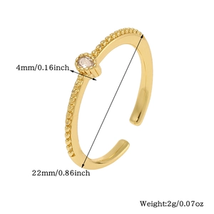 Detail of 18K gold teardrop ring with beaded texture and gemstone size measurements