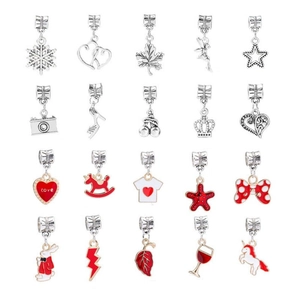 Macro display of 20 silver and red DIY charms featuring snowflakes, hearts, and unicorns