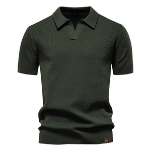 Detailed knit texture and leather logo patch on dark green short sleeve Polo shirt