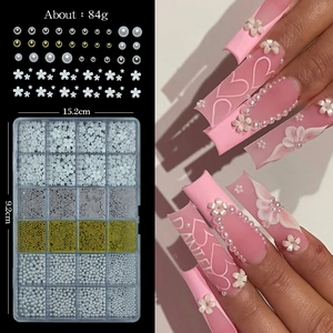 Detailed 24-compartment nail art kit with white flowers, pearls and beads measuring 15.2x9.2cm