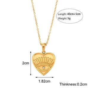 Golden heart pendant necklace with devil eye design including size and weight measurements