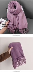 Detail of lilac cashmere-like scarf featuring colorful dots and long fringe textures