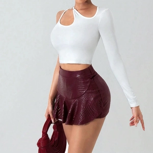 White one-shoulder long sleeve top and wine red crocodile-texture leather mini skirt