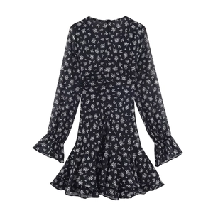 Floral print long sleeve dress with ruffle hem and layered details on black fabric