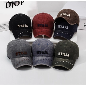 Detailed group view of vintage washed cotton baseball caps in seven assorted colors