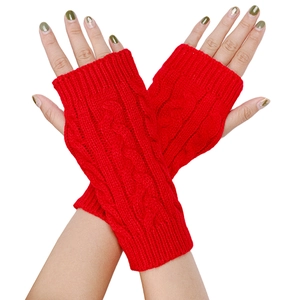 Red cable knit fingerless gloves with twisted texture, worn by a model on white background