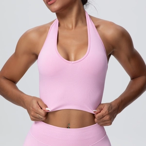 Close-up of pink halter yoga bra with ribbed texture and high-waist leggings set