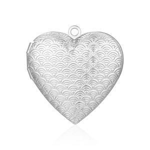 Close-up of heart-shaped stainless steel locket pendant with embossed scale pattern