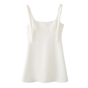 Close-up of a white A-line dress featuring a square neckline and wide shoulder straps