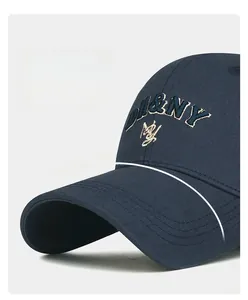 Detailed view of embroidery and reinforced stitching on a blue curved brim baseball cap