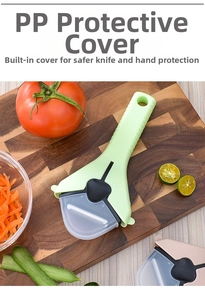 Ergonomic green vegetable peeler with a transparent protective cover on wooden board