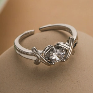 Silver-plated knot ring with clear zircon on a natural stone base, adjustable open design