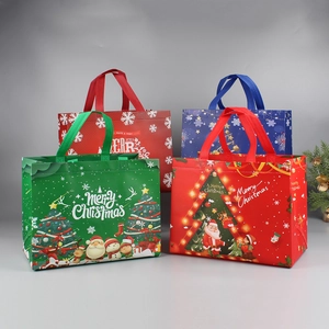 Close-up of vibrant Christmas non-woven gift bags in red, blue and green colors