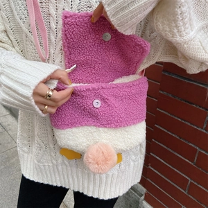 Detail of cute lamb wool duck crossbody bag with pink flap and magnetic closure