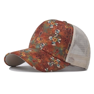 Detail of vintage baseball cap mesh back with cross and sunflower floral print pattern