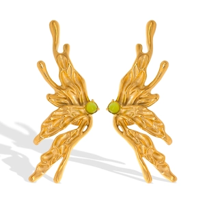 Artistic gold butterfly earrings with green natural stones in a minimalist summer style
