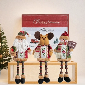 Detailed view of sitting plush Santa, reindeer, and snowman dolls with beaded long legs