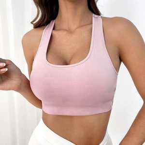 Pink high-impact seamless yoga sports bra with wide straps and ribbed hem for fitness