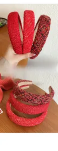Close-up of red tweed padded headbands in crimson, sparkle red and vintage mix patterns