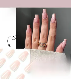 Macro detail of nude ballet nails with pink marble texture and gradient effect