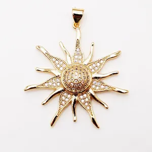 Detailed close-up of sunburst pendant with micro-pave cubic zirconia and 18K gold plating