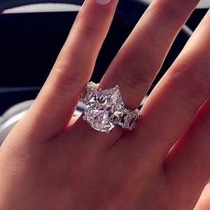 Luxury silver-tone teardrop zircon ring with pave diamond accents for women on finger