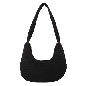 Minimalist black pleated crescent shoulder bag with wide strap in textured fabric finish