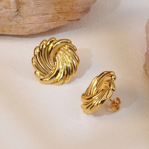 French vintage style gold spiral twist stud earrings with polished metallic texture