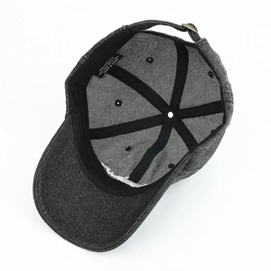 Inside view of dark grey denim baseball cap showing 100% cotton material and stitching