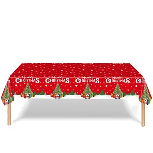 Close-up of festive red Christmas tablecloth with reindeer and snowflake patterns