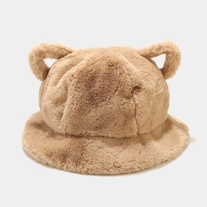 Detail of the thick plush brown bucket hat with cute bear ears and fuzzy faux rabbit fur texture