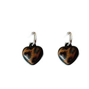 Retro heart-shaped leopard print stud earrings with silver pins on a white background
