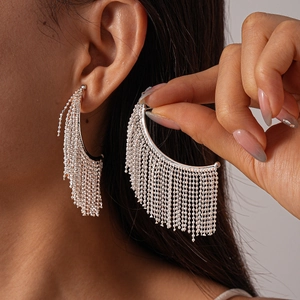 Elegant silver metallic bead tassel drop earrings on model for a sophisticated look