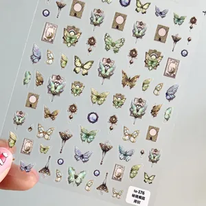 Detail view of vintage butterfly nail stickers with artistic frames on a transparent film