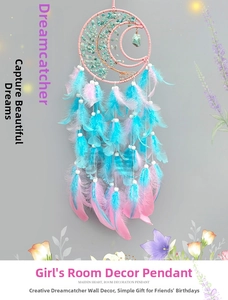 Detail of moon-shaped dream catcher with turquoise tree of life and pastel feathers