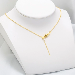 Adjustable 18K gold-plated O-chain with lobster clasp and slider bead on white silk