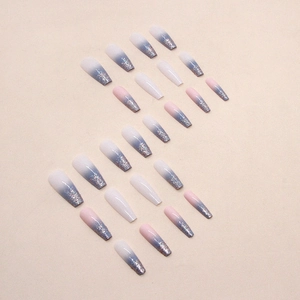 Long coffin fake nails featuring blue and purple gradient with silver glitter finish